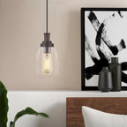 Suspension moderne avec abat-jour en verre transparent et finition bronze huilé