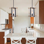 Suspension Braum à une lumière, cage métallique rectangulaire noir mat et bronze doré, abat-jour cylindrique en verre transparent.